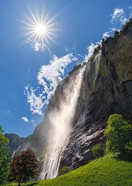 Waterfall in Switzerland with Bright Sun