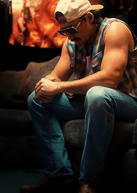 Man in Plaid Vest Sitting