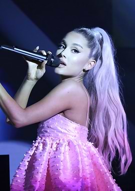 Ariana Grande performing with microphone