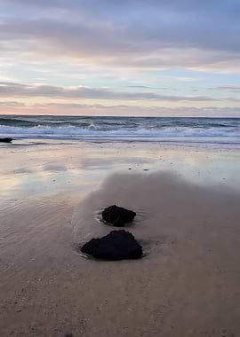 Beach rocks at sunset