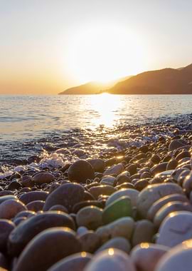 Sunset on a pebble beach