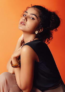 Portrait of a woman on orange background anupama