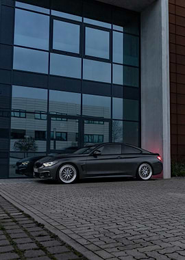 Gray BMW 440i Parked by Building