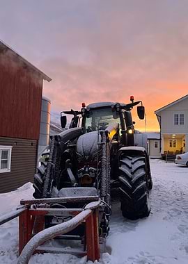 Snowy Tractor at Sunset