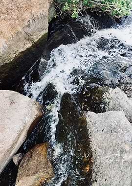 Fast Flowing Stream Over Dark Rocks
