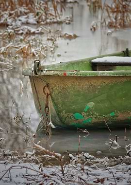 Green Boat in Winter Landscape