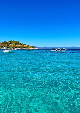 Turquoise Sea with Boats and Island
