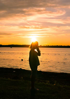 Silhouette at Sunset by the Lake