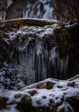 Frozen Waterfall with Icicles and Snow