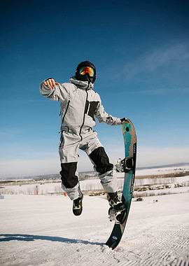 Snowboarder in Action on Snowy Mountain