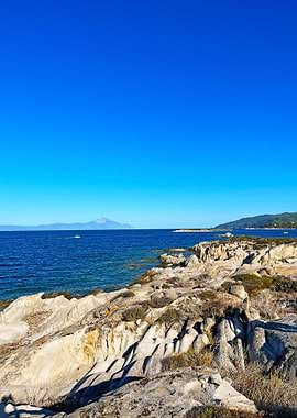 Rocky Coastline with Blue Sea and Sky