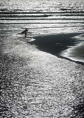 Surfer on the beach in monochrome