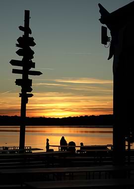 Sunset at the lake with silhouettes
