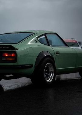 Green Datsun on Wet Asphalt