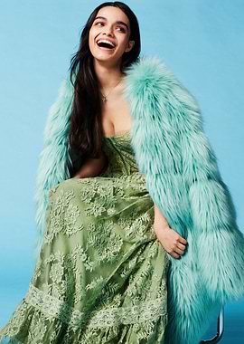 rachel zegler in Green Dress and Fur