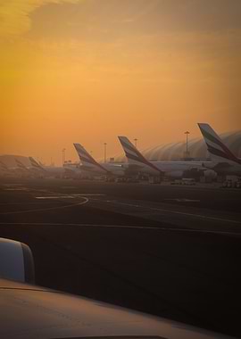 Emirates Airbus A380 Airplanes at Dubai Airport during Sunrise