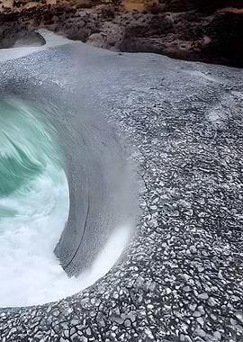 Waterfall with rocks and green water