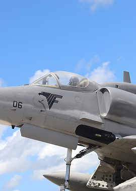 Gray Military Jet Against Blue Sky