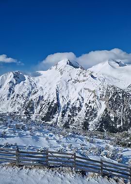 Snowy Mountain Landscape with Wooden Fence