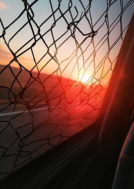 Sunset Through Fence