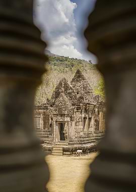 Ancient Temple Ruins Through Stone Pillars