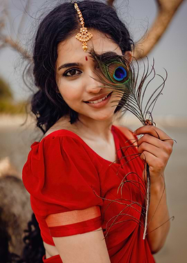 mamitha baiju with Peacock Feather Portrait