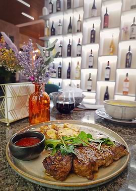 Steak Dinner with Wine and Flowers