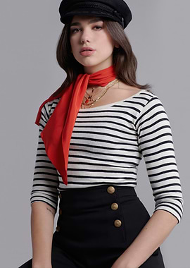 Dua Lipa in striped shirt and cap