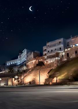 Night cityscape with moon and stars