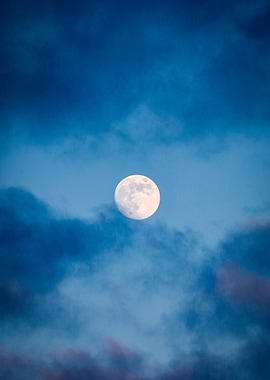 Full Moon in Cloudy Blue Sky