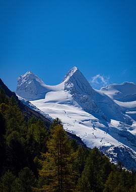 Snowy Mountain Peaks Under Blue Sky