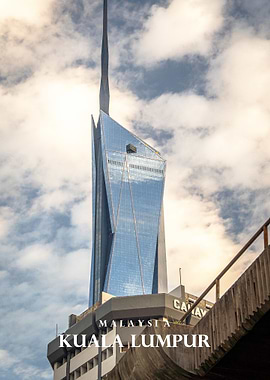 Kuala Lumpur skyscraper against cloudy sky