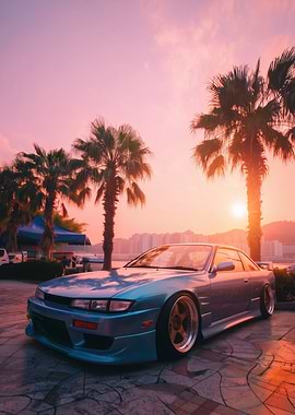 Teal Car at Sunset with Palm Trees