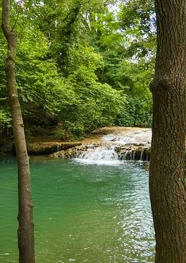 Photography of Serene Waterfall in Lush Green Forest