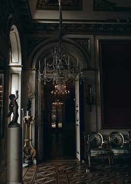 Ornate Hallway with Chandeliers and Statues