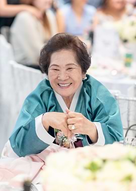 Smiling Woman in Traditional Korean Dress