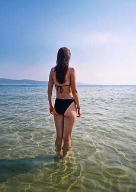 Woman in Black Bikini in Ocean