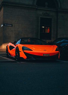 Orange McLaren parked on city street