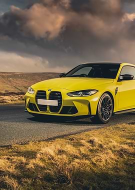 Yellow BMW M4 on a road