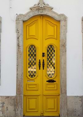 Bright Yellow Door with Stone Frame
