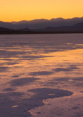Sunset over a salt flat landscape