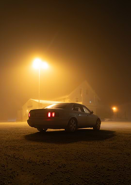 Car in Foggy Night Scene