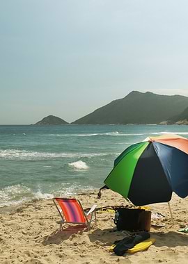Colorful Beach scene with umbrella and chair
