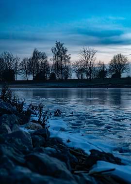 Icy Riverbank at Dusk