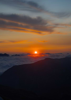 Mountain Sunrise Above Clouds