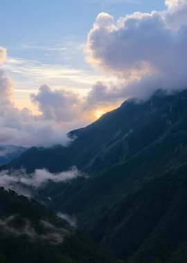Mountain Peaks Emerging Through Clouds
