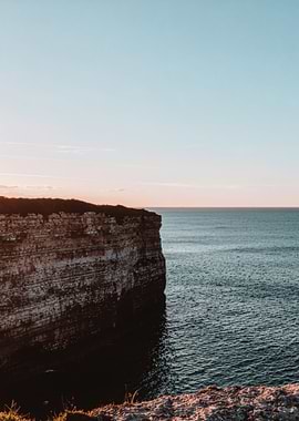 Coastal Cliff at Sunset