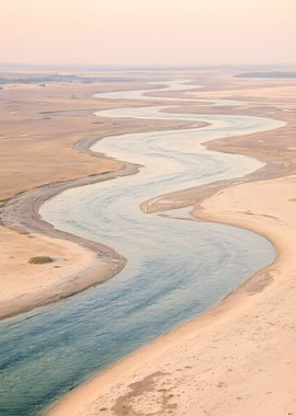 Winding River Through Sandy Landscape