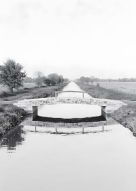 Monochrome Canal with Bridge Reflection