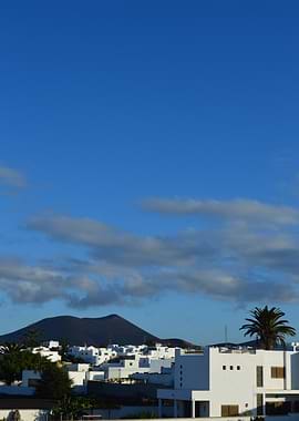 White Houses of Lanzarote with Volcanic Mountain Under Blue Sky